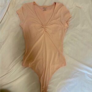 Light pink body suit from American Eagle. Size Medium.